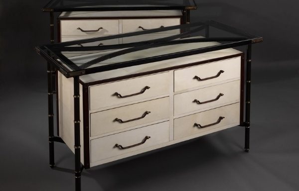 A pair of vellum and leather covered commodes by Jacques Adnet. France. crica 1960
