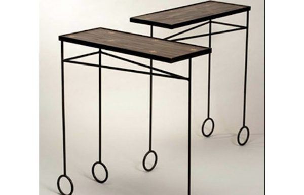 A pair of metal and straw veneer tables by Jean Royere. Circa 1960.
